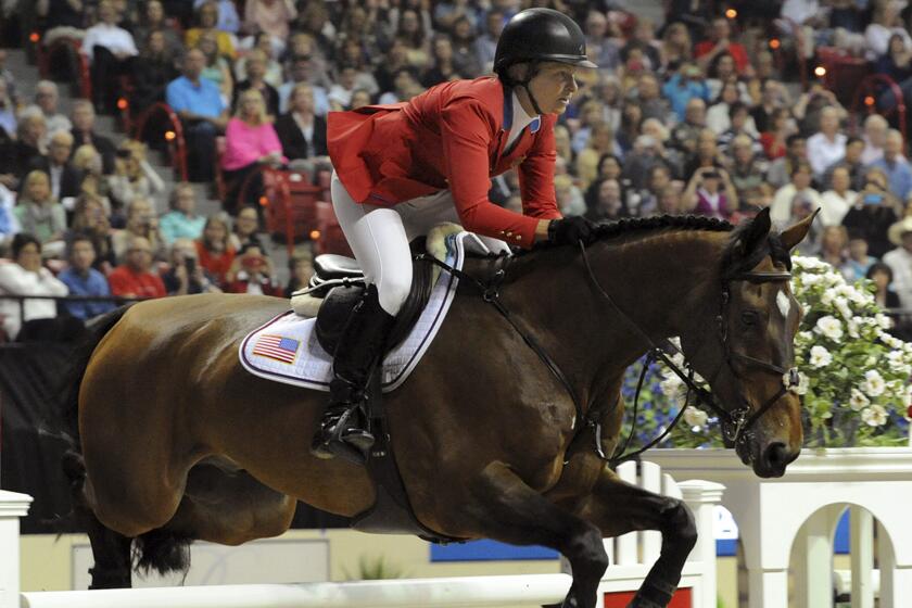Elizabeth Madden of the U.S. rides her horse, Simon, to a second-place finish at the Longines FEI World Cup Jumping final II in Las Vegas on Friday.
