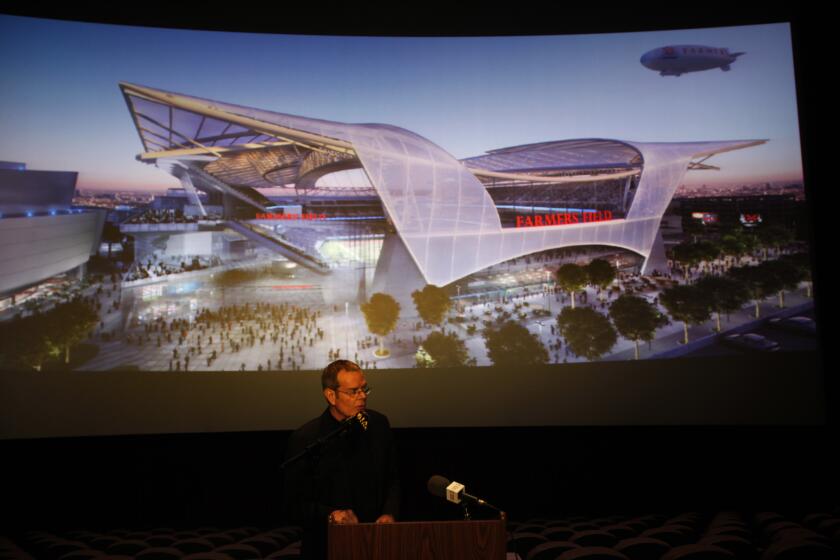 Robinson Chavez, Michael –– B581695590Z.1 Los Angeles, Ca. November 15, 2011 A new design and renderings of the proposed Farmers Field stadium project were released during a press conference at LA Live on Tuesday morning. Ron Turner, the principal at Gensler, the architectural firm designing the new stadium, shows images of the project. (Photo by Michael Robinson Chavez/Los Angeles Times)