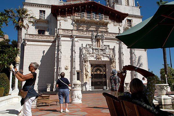 Tourists snap photos of the extravagant architecture outside of Hearst Castle, part of a state historic park at San Simeon.