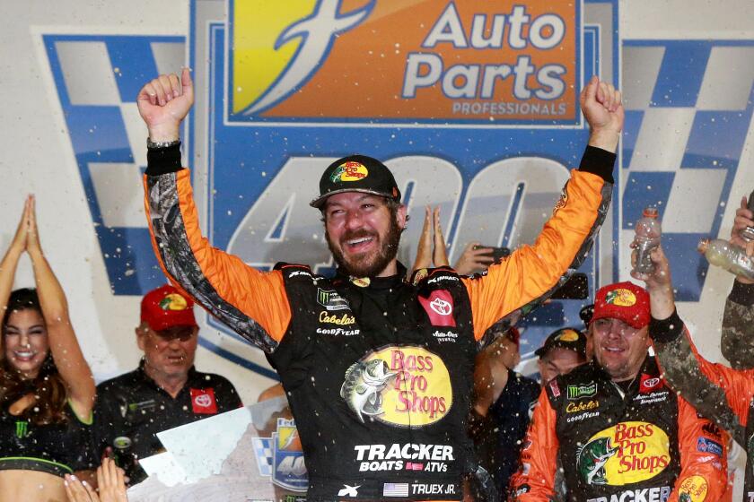 RICHMOND, VIRGINIA - SEPTEMBER 21: Martin Truex Jr., driver of the #19 Bass Pro Shops Toyota, celebrates in Victory Lane after winning the Monster Energy NASCAR Cup Series Federated Auto Parts 400 at Richmond Raceway on September 21, 2019 in Richmond, Virginia. (Photo by Sean Gardner/Getty Images)