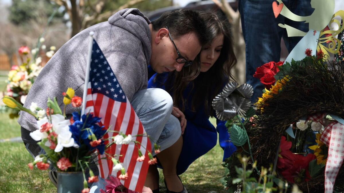 Michael Scott and Marie Sophie pay a visit on April 20, 2019, to the grave of his sister, Rachel Scott, at the Chapel Hill Memorial Gardens in Littleton, Colo.