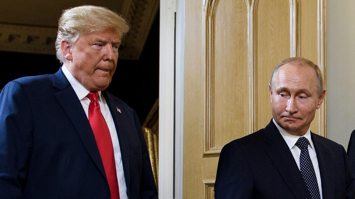President Trump and Russian President Vladimir Putin arrive for a meeting in Helsinki, Finland, on July 16, 2018.
