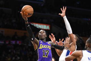 Lakers guard Dennis Schroder drives to the basket against the Pistons in the first quarter at Crypto.com Arena Nov. 19, 2022.