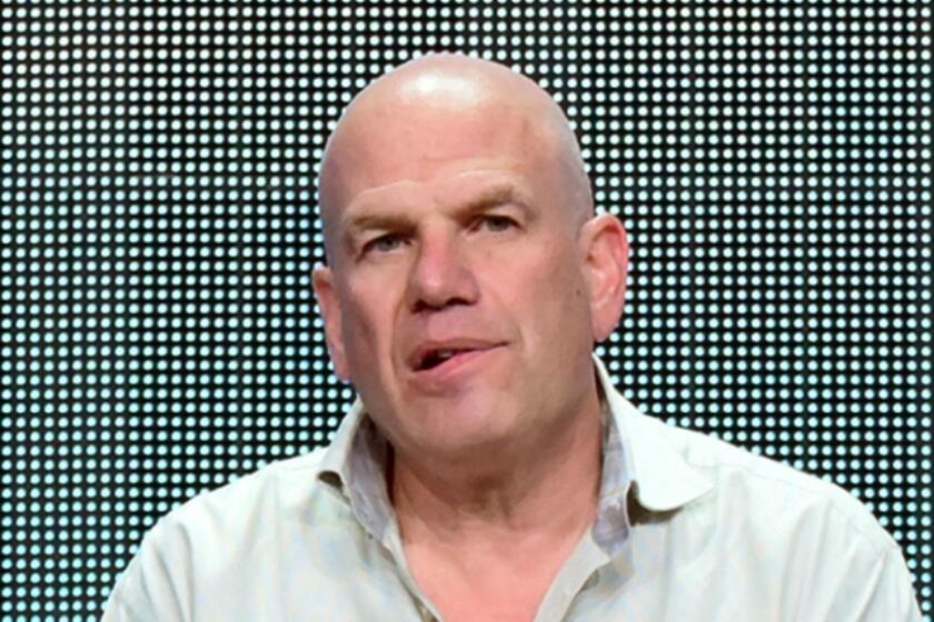 FILE - In this July 30, 2015 file photo, producer David Simon appears during the "Show Me a Hero" panel at the HBO 2015 Summer TCA Tour in Beverly Hills, Calif. Simon and Fox News Channel host Sean Hannity are tossing vulgarities at each other on social media. Simon, who made ???The Wire,??? sent out a mocking tweet about Hannity hosting a Donald Trump town hall meeting about issues confronting black America. (Photo by Richard Shotwell/Invision/AP, File)