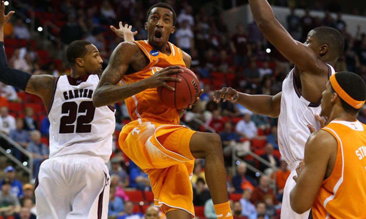 Tennessee's Jordan McRae, center, goes up for a shot during the Volunteers' victory over Massachusetts in the second round of the NCAA tournament on Friday.