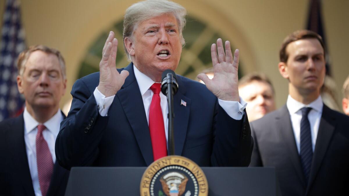 President Trump speaks during a news conference to discuss the revised U.S. trade agreement with Mexico and Canada in the Rose Garden of the White House on Oct. 1.