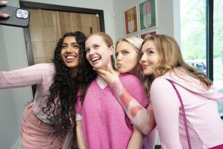 Avantika Vandanapu, Angourie Rice, Reneé Rapp and Bebe Wood all wear pink blouses as they pose for a group selfie together.