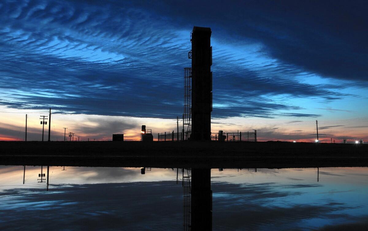 Oil pumps and drilling equipment in an oil field in Kern County, where the majority of California's oil and gas production is centered. A year's worth of data from tests on water coming out of hundreds of fracked wells found high concentrations of benzene, a human carcinogen.