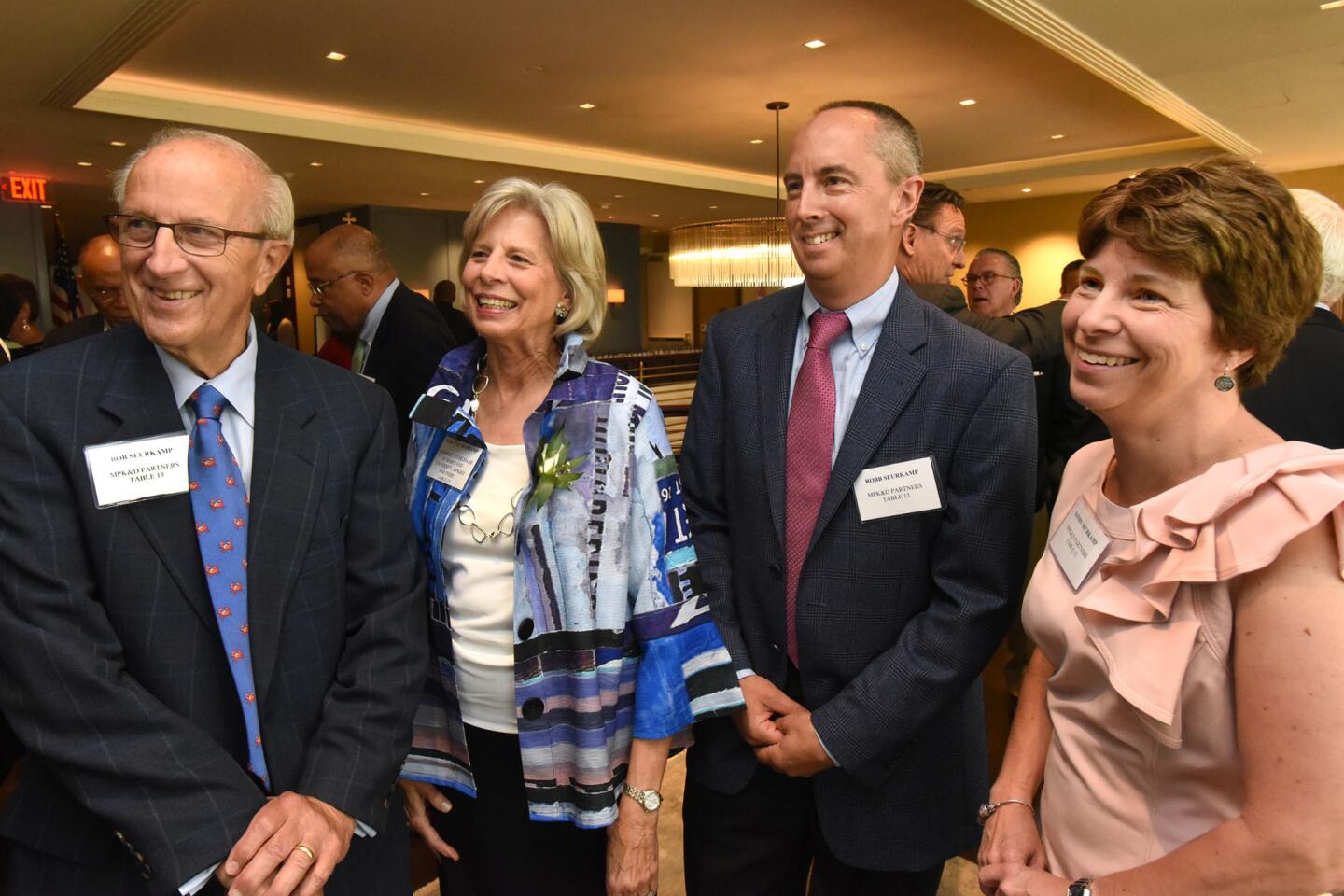 Bob and Mary Seurkamp with their son, Robb Seurkamp, and his wife Andrea Seurkamp, at the Baltimore Sun Hall of Fame party at the Center Club.
