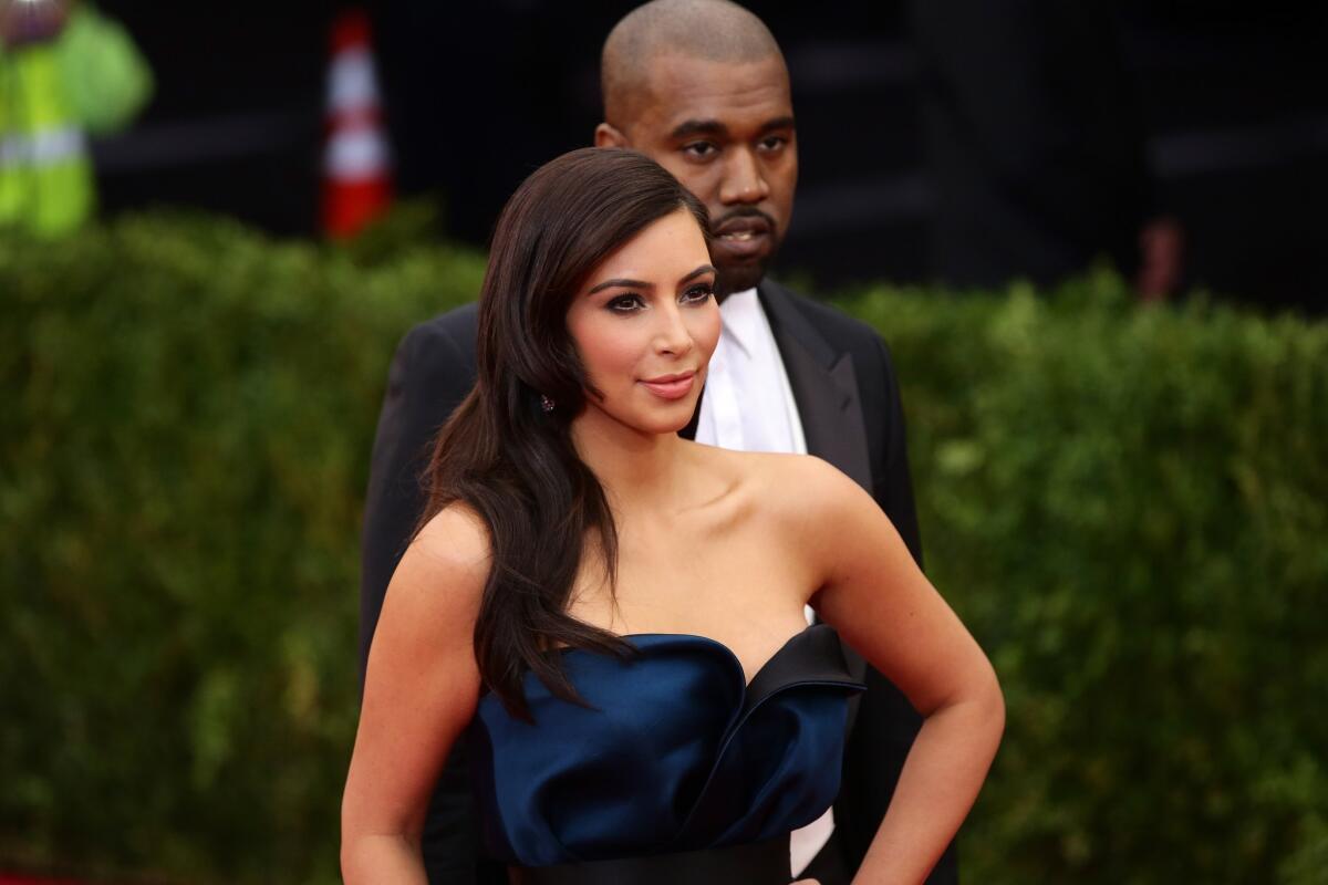 Kim Kardashian and Kanye West attend the Met Gala on May 5 in New York.