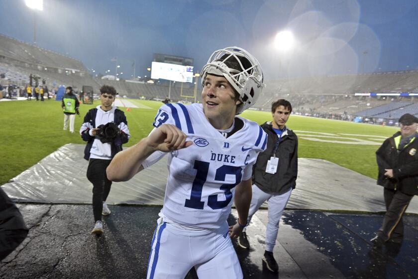 Duke quarterback Riley Leonard (13) reacts to fans after their victory over UConn in an NCAA college football game, Saturday, Sept. 23, 2023, in Hartford, Conn.(AP Photo/Josh Reynolds)