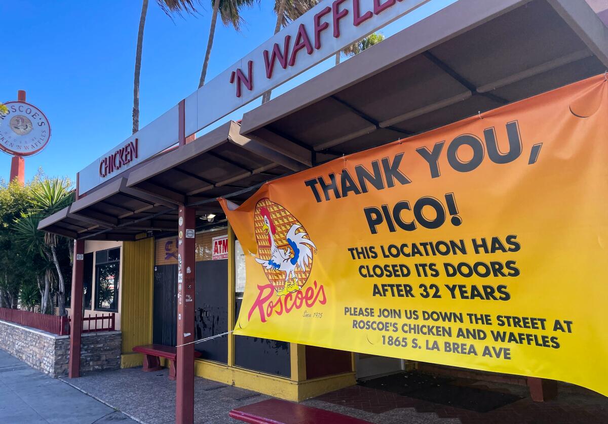 A large yellow and orange banner hanging outside a restaurant says "THANK YOU, PICO!" with directions to another location.