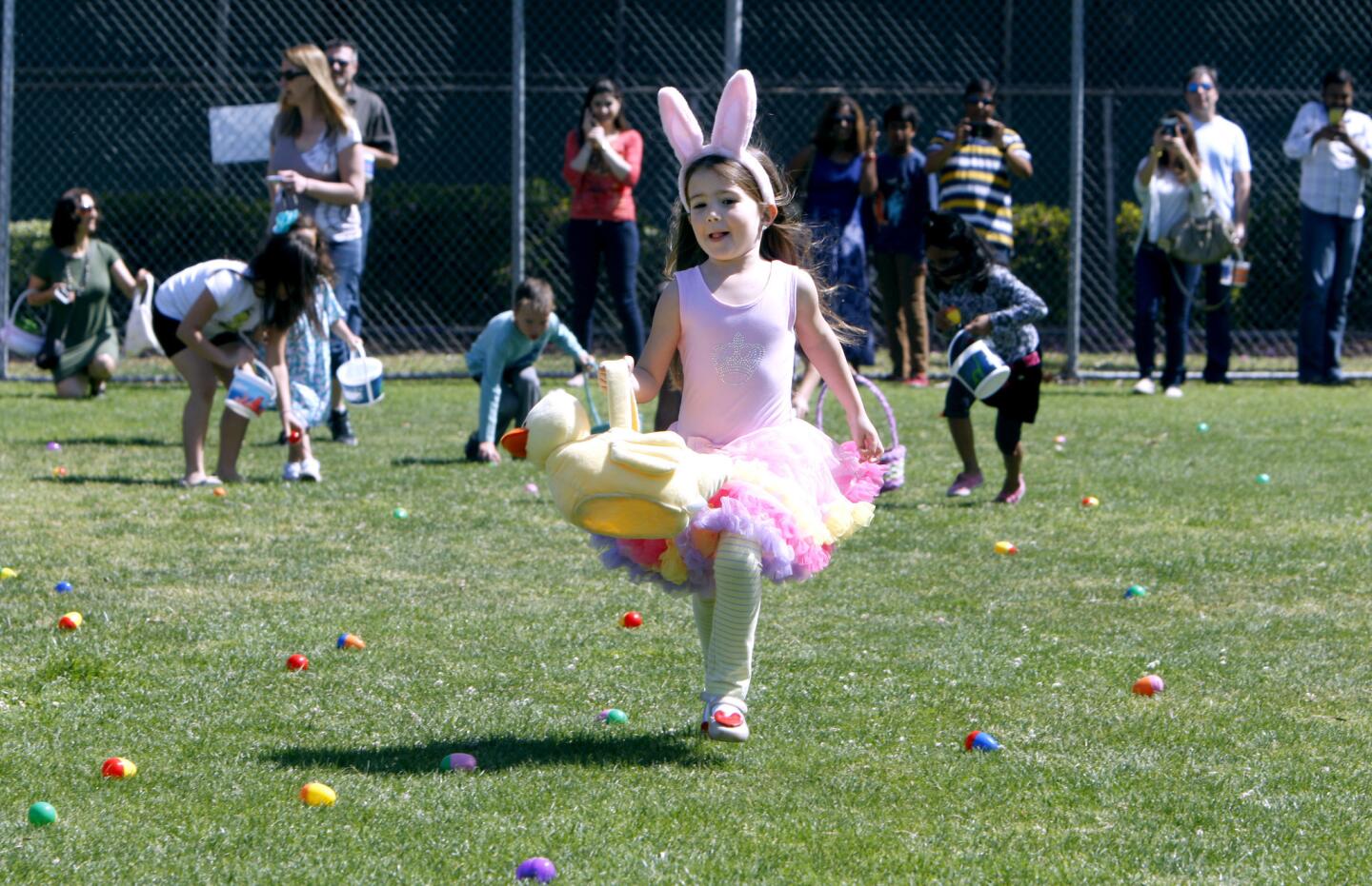 Mia Mahoney, 5 of Burbank, races out to get easter eggs during the annual city of Burbank Spring Egg-Stravaganza at McCambridge Park in Burbank on Saturday, April 15, 2017. The free egg hunts included 2 for four year olds and under and 2 for 5-10 year old children. The event also included mascot meet and greet, bounce houses, games, prizes and pictures with the Easter bunny.