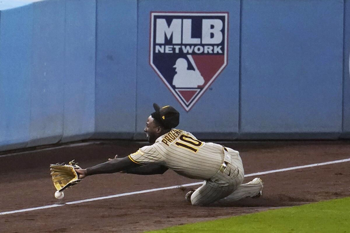 The Padres' Jurickson Profar fails to make diving catch in the eighth inning Thursday night.
