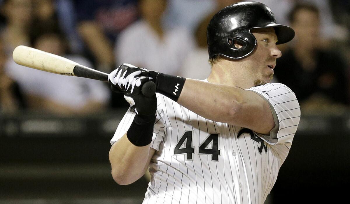 Slugger Adam Dunn delivers a run-scoring double against Cleveland in one of his final games for the White Sox last week.