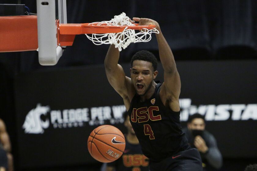 USC's Evan Mobley dunks during the second half of the Trojans' win at Washington State on Feb. 13, 2021.