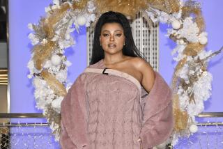 Taraji P. Henson from "The Color Purple" participates in the ceremonial lighting of the Empire State Building