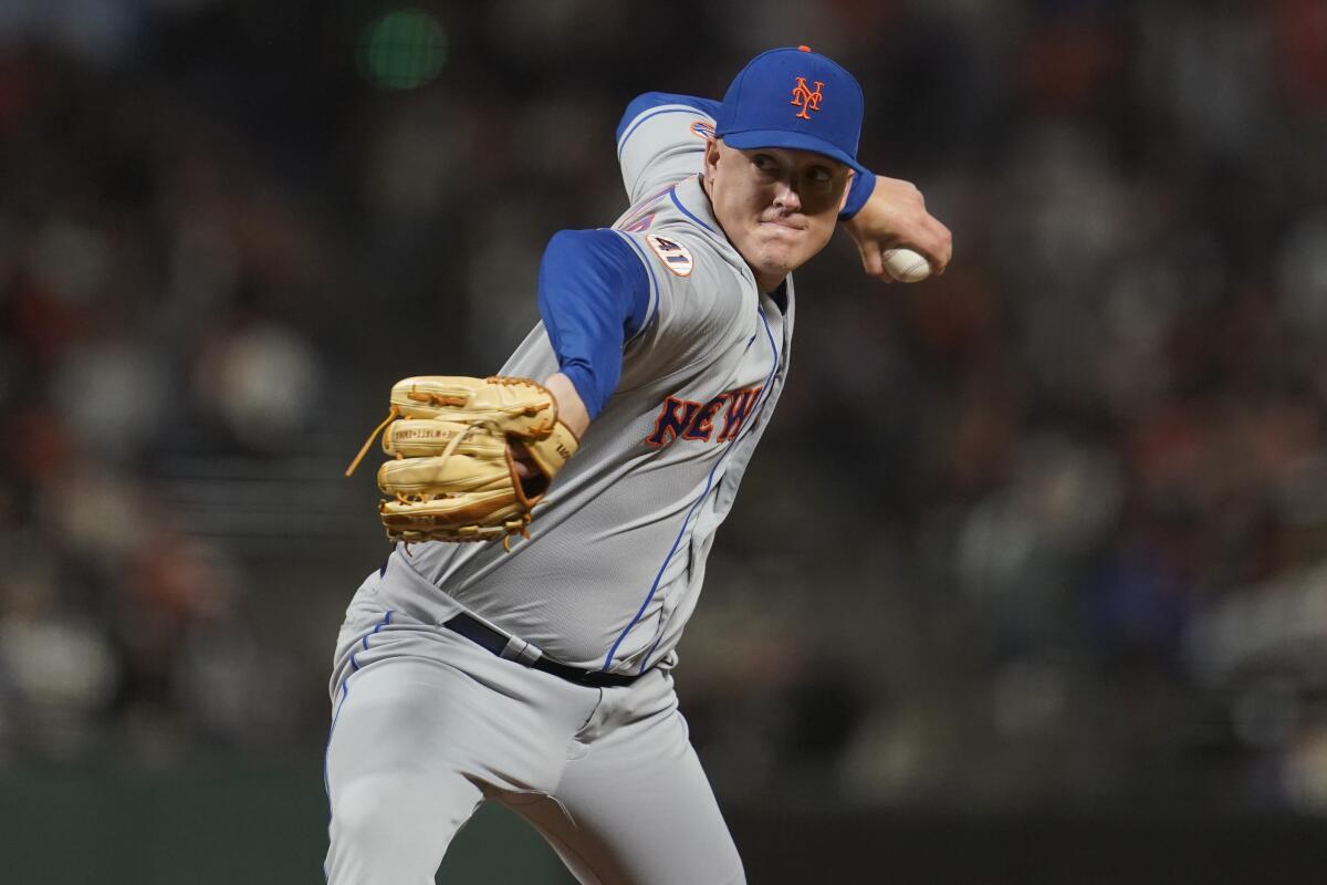 New York Mets pitcher Aaron Loup throws to a San Francisco Giants batter.