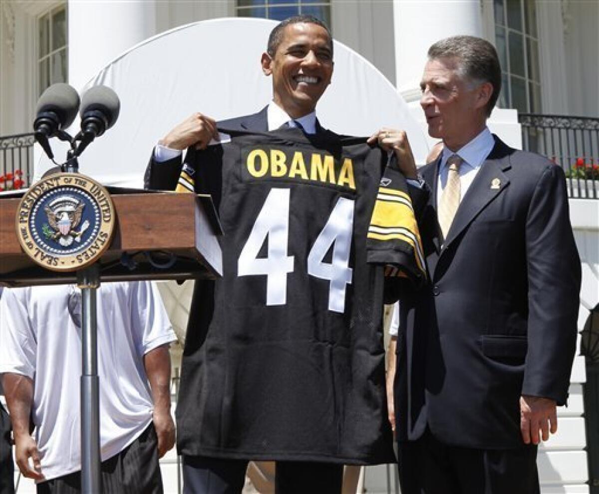 U.S. President Barack Obama receives a game jersey from San