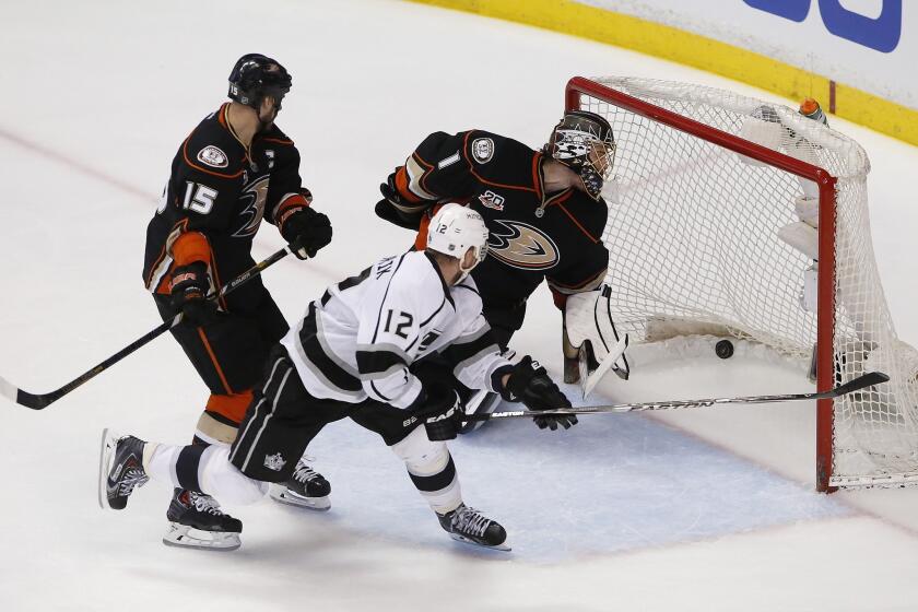 Kings forward Marian Gaborik, right, scores the winning goal in front of Ducks captain Ryan Getzlaf and goalie Jonas Hiller in the Kings' 3-2 overtime victory in Game 1 of the Western Conference semifinals at Honda Center.
