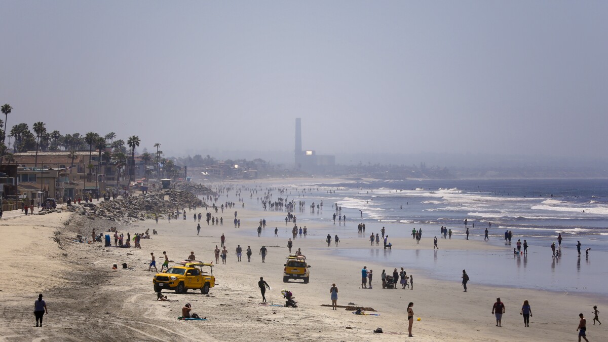San Diegans Get Back To The Beach Cautiously On Closely