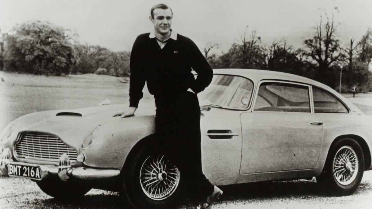Sean Connery with an Aston Martin DB5 for the James Bond film  "Goldfinger."