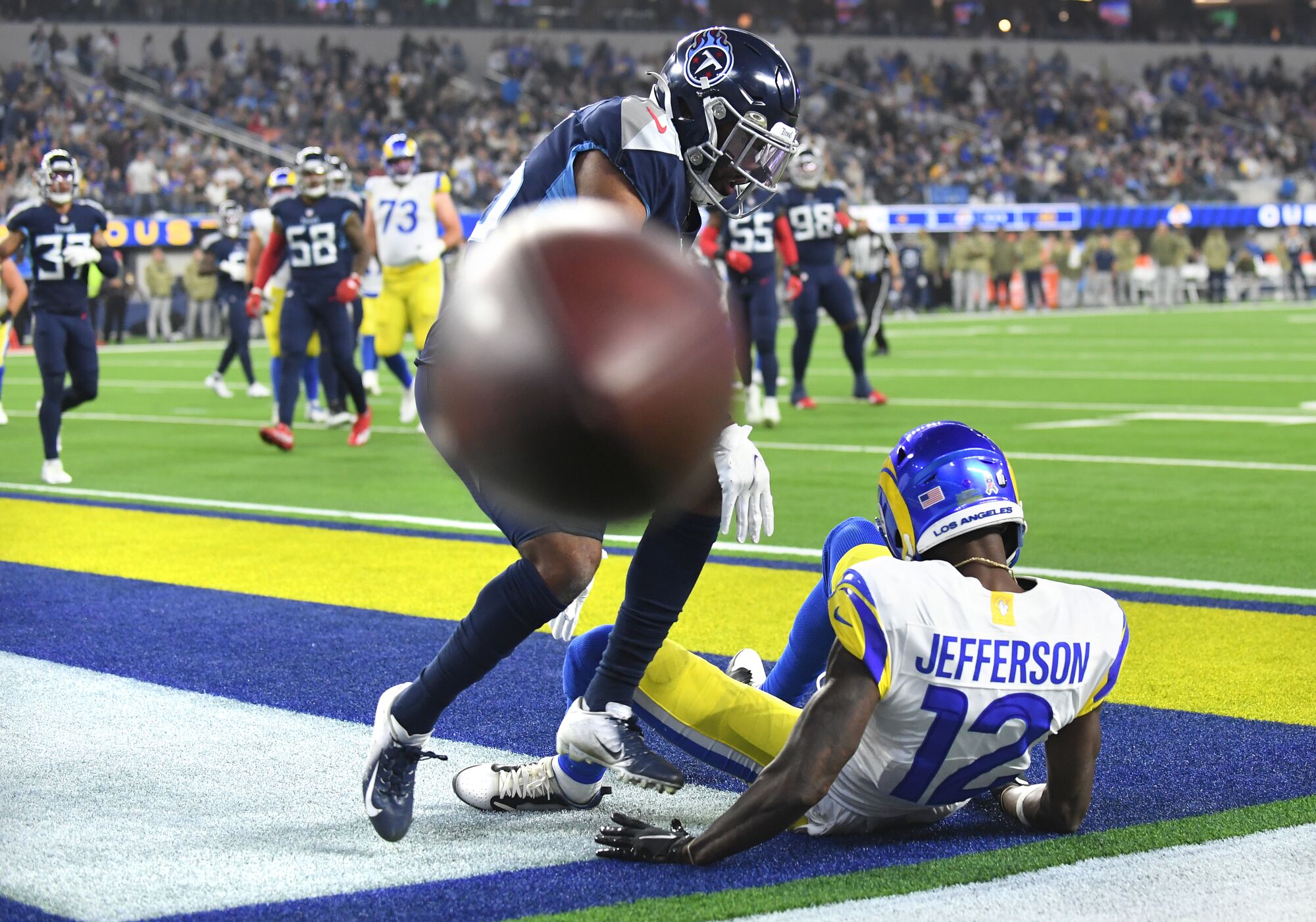 Rams receiver Van Jefferson can't make the catch in the end zone as Titans defensive back Chris Jackson defends