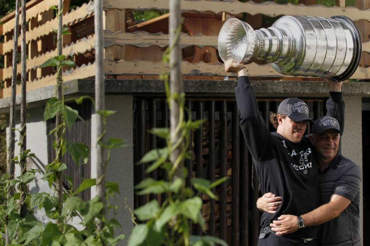 Embracing his son, Anze, Matjaz Kopitar shares the joy of his Stanley Cup victory in 2012.