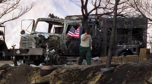 A U.S. Forest Service firefighter visits the scene where five of his colleagues were killed on Oct. 26, 2006 by the windblown Esperanza fire's unpredictable flames.