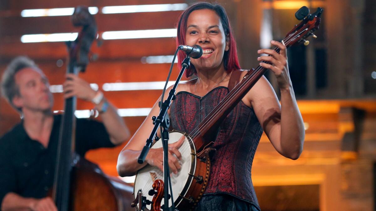 Rhiannon Giddens, shown performing at the Stagecoach Country Music Festival earlier this year, has been chosen to receive a 2017 MacArthur Foundation Fellowship, the so-called genius grants.