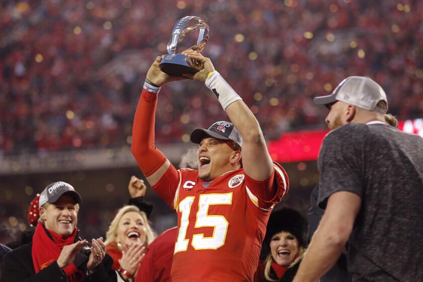 KANSAS CITY, MISSOURI - JANUARY 19: Patrick Mahomes #15 of the Kansas City Chiefs holds up the Lamar Hunt trophy after defeating the Tennessee Titans in the AFC Championship Game at Arrowhead Stadium on January 19, 2020 in Kansas City, Missouri. The Chiefs defeated the Titans 35-24. (Photo by David Eulitt/Getty Images)