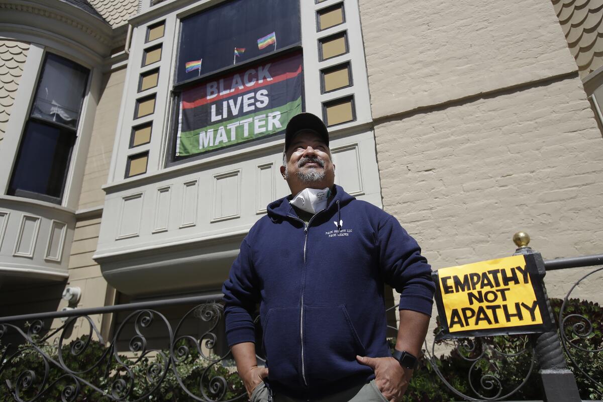 James Juanillo poses outside his home in San Francisco