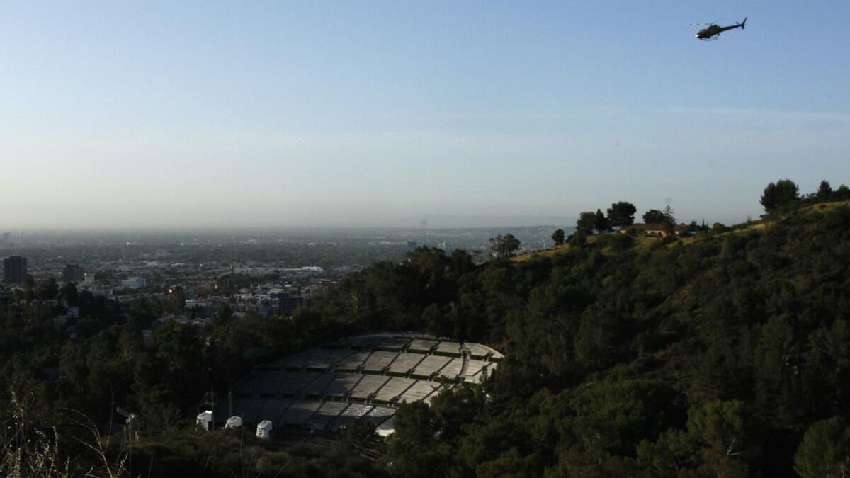 A helicopter flies over the Hollywood Bowl. Actors have different approaches to coping with the noise during performances.