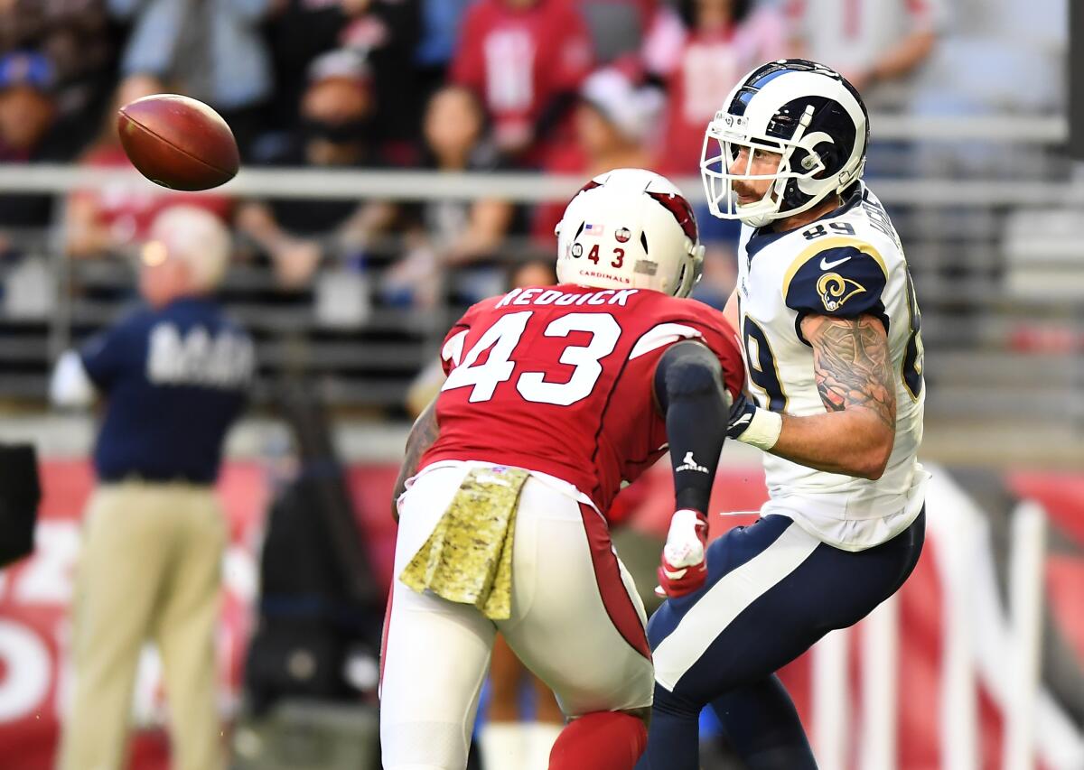 Rams tight end Tyler Higbee prepares to make one of his seven catches against the Arizona Cardinals.