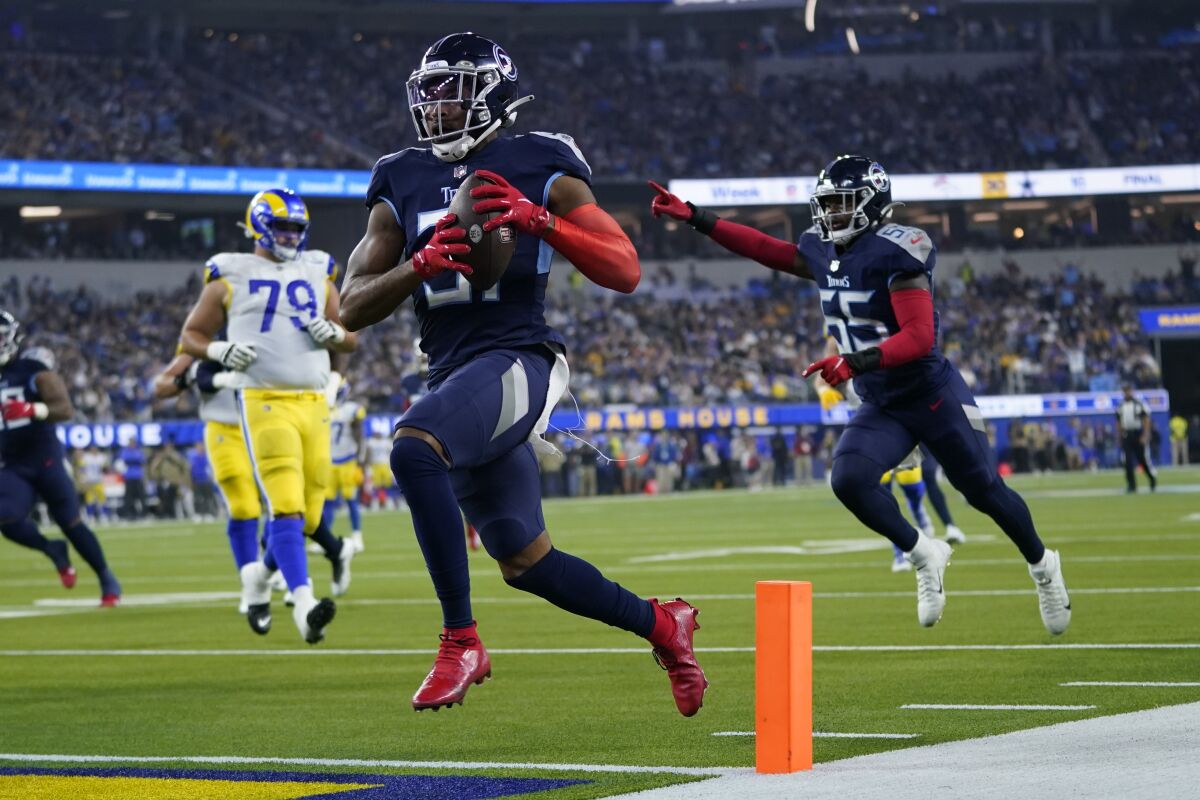 Tennessee Titans free safety Kevin Byard scores a touchdown after grabbing an interception during the first half of an NFL football game against the Los Angeles Rams Sunday, Nov. 7, 2021, in Inglewood, Calif. (AP Photo/Ashley Landis)