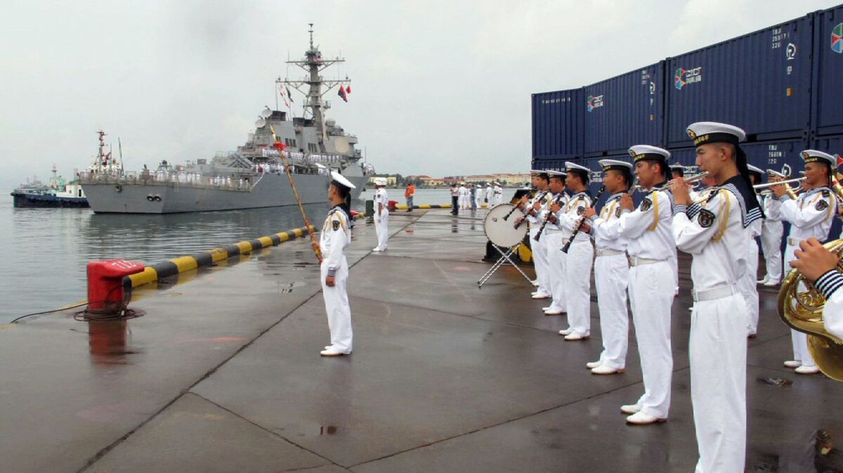 In this Aug. 8, 2016, photo, a military band plays as the U.S. guided-missile destroyer Benfold arrives in port in Qingdao, China. This weekend the ship passed through the Taiwan Strait.