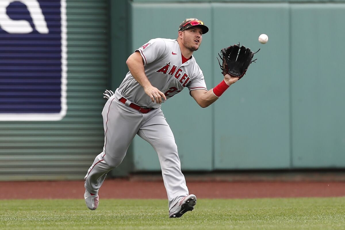 Angels center fielder Mike Trout makes a catch on the line out by Boston's J.D. Martinez.
