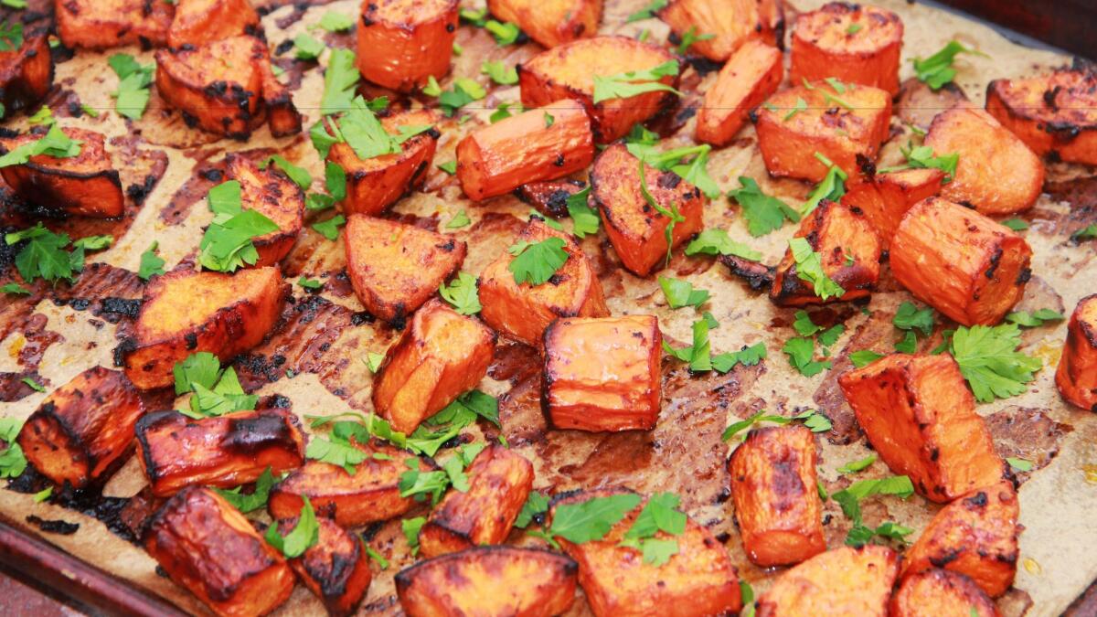 Roasted sweet potatoes and carrots. (AP)