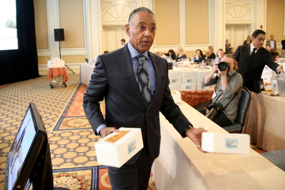 Actor Giancarlo Esposito passes out boxes of "Los Pollos Hermanos" chicken during the 'Better Call Saul' panel at the Television Critics Assn. press tour.