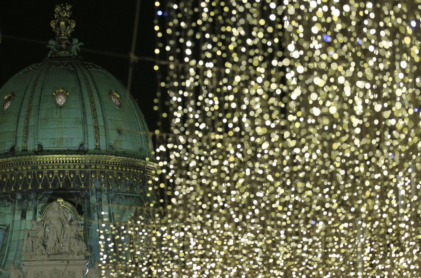 More dazzling Christmas decorations set off the domed Michaelertrakt palace.