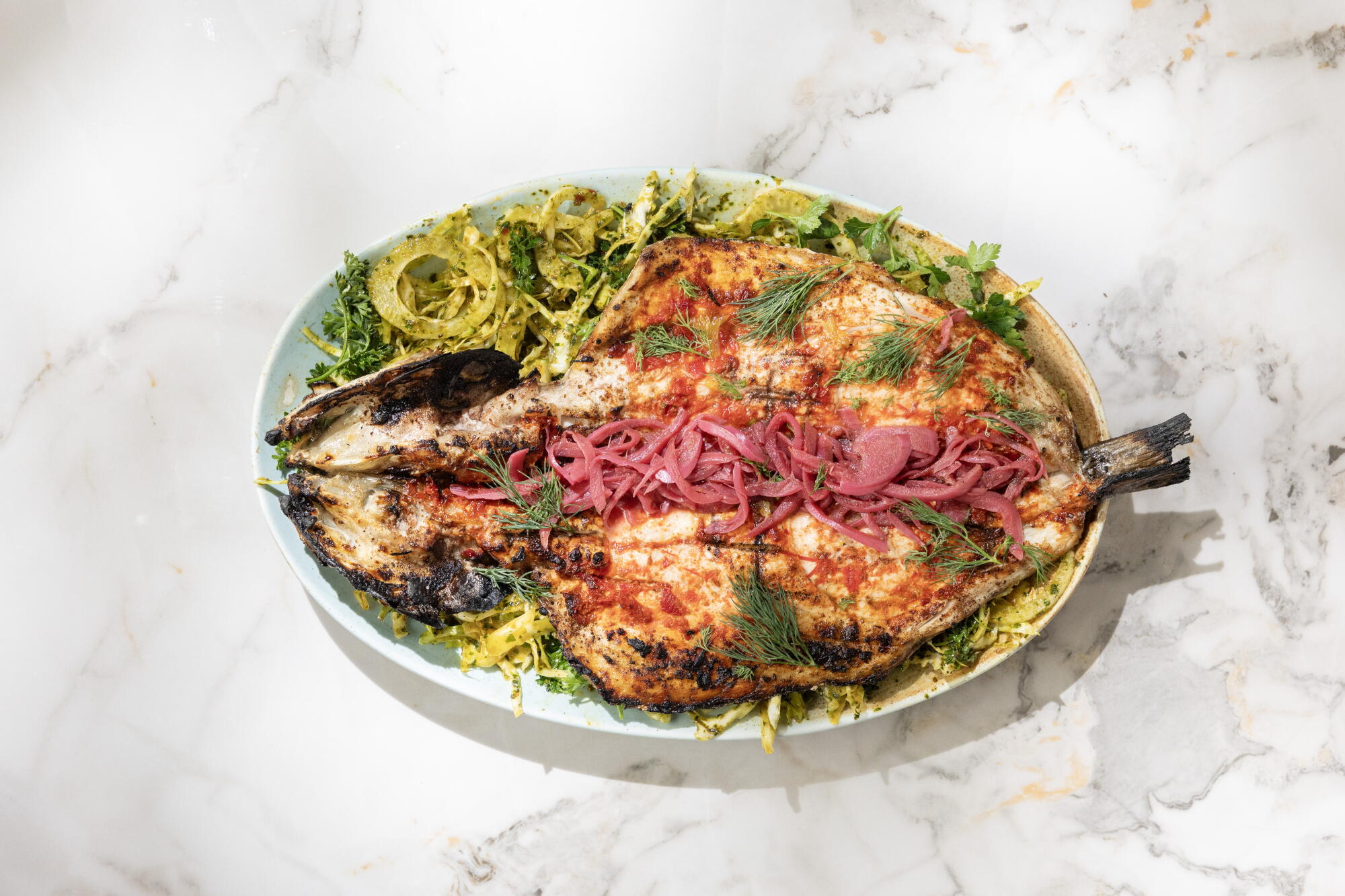 Chef Raydan Bill Addison reviews the live-fire feasts at Maydan L.A. in West Adams ...