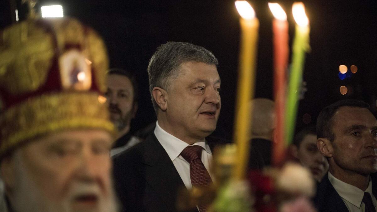 Ukrainian President Petro Poroshenko, center, attends an Orthodox Easter celebration April 8 in the Volodymyrskiy Monastery in Kiev, Ukraine.