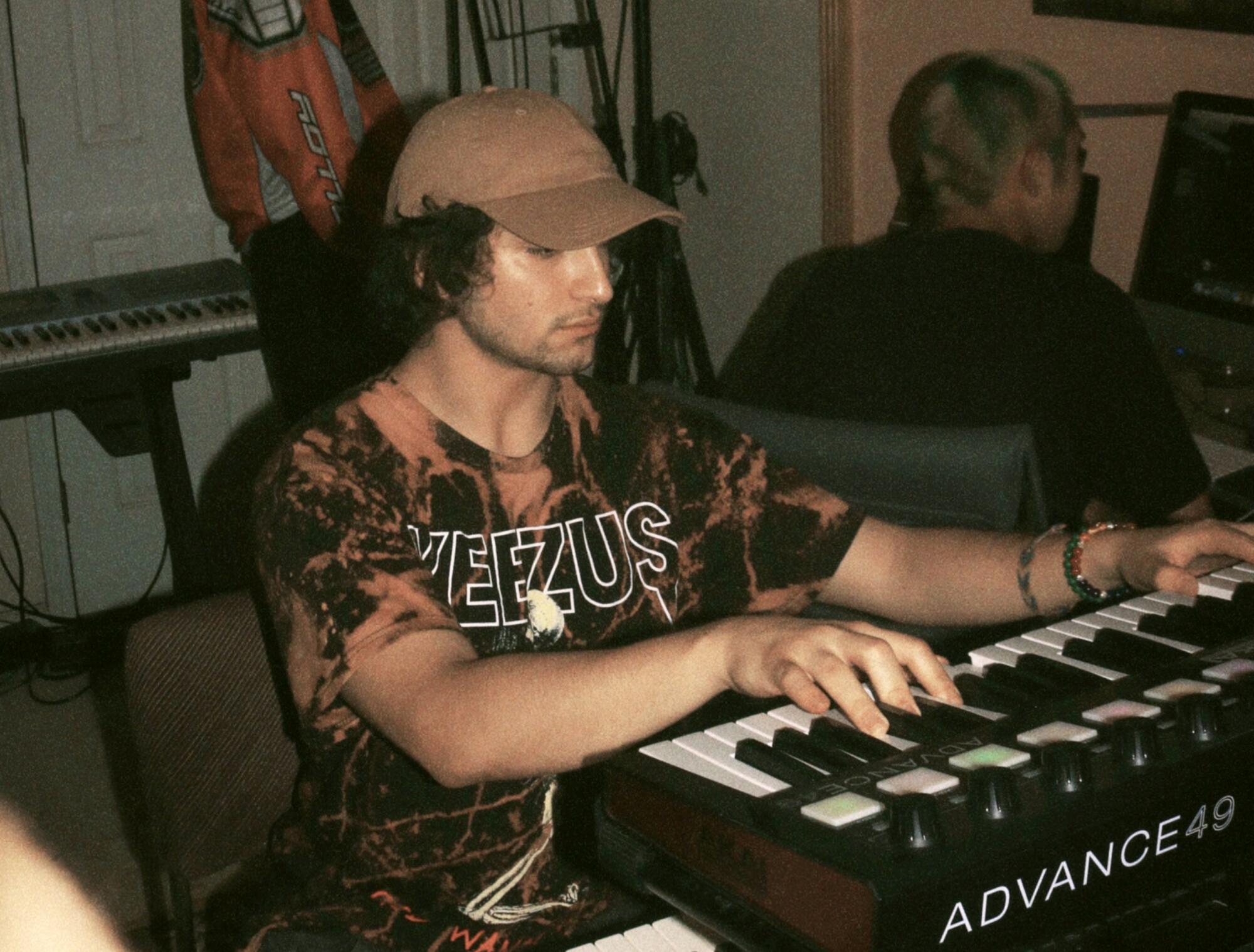 A man plays a keyboard