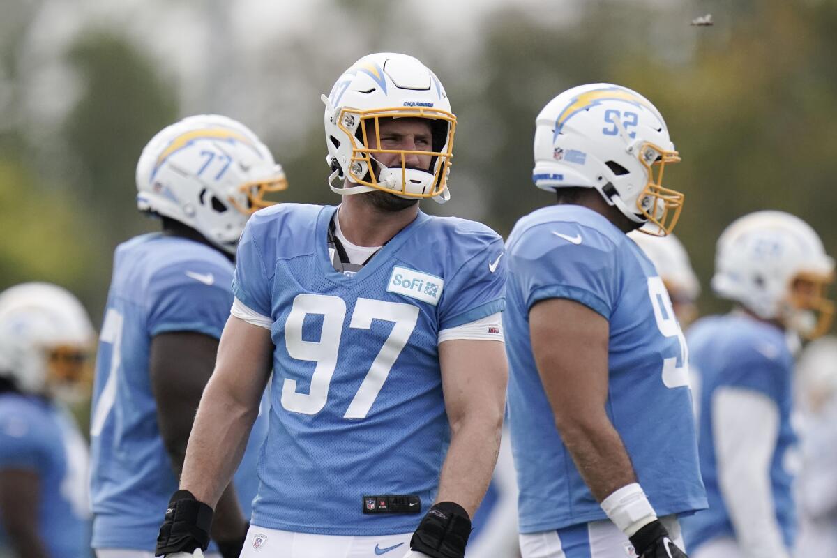 Los Angeles Chargers defensive end Joey Bosa stands on the field during practice Aug. 17