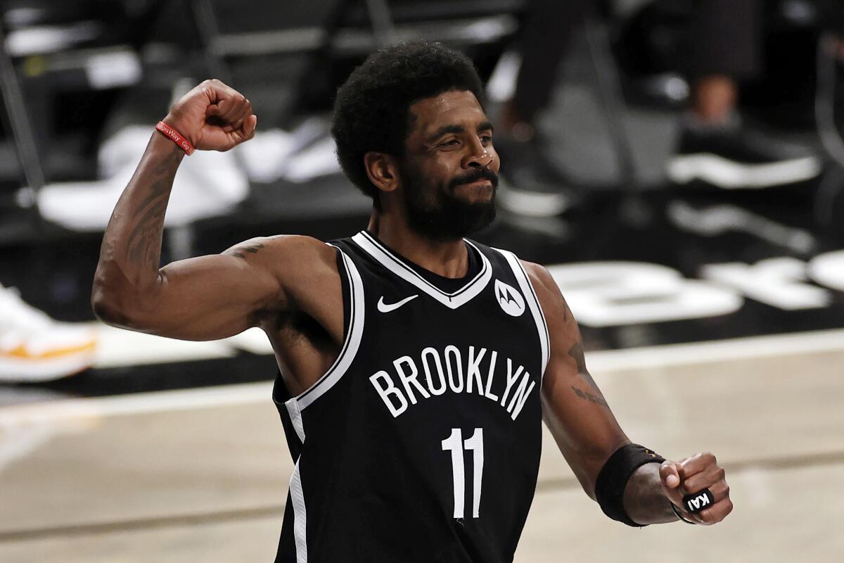 Nets guard Kyrie Irving reacts during a playoff game.
