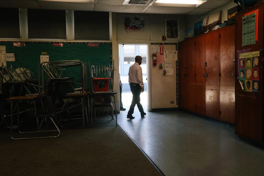 Los Angeles, CA - July 01: Gustavo Gonzalez , the Director of Maintenance Operations and Transportation exits a classroom that is in desperate need of new carpeting at Hosler Middle School in Lynwood on Monday, July 1, 2024 in Los Angeles, CA. Next week, the legislature will be voting on whether to put a $10 billion school bond on the ballot for fund facilities improvements at California public schools. The last bond failed on the ballot in 2020, and there is plenty of pent of demand for improvements across the state. Low-income school districts like Lynwood have historically gotten far less money from the state for school improvements than wealthy districts, because of the inequitable way that funds are distributed by the state. Some of Lynwood schools were built in 100 years ago and are in dire need of modernization. The district says they need about $750,000,000 in repairs but the district can only raise a local bond of $60-80 million because the tax base is so poor. (Dania Maxwell / Los Angeles Times)