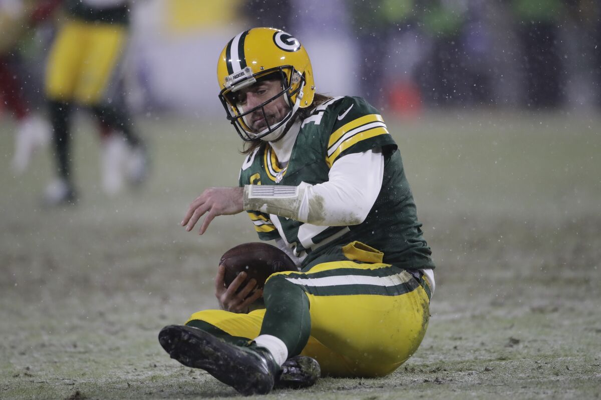 The Packers' Aaron Rodgers reacts after being sacked by the 49ers' Arik Armstead during the second half.