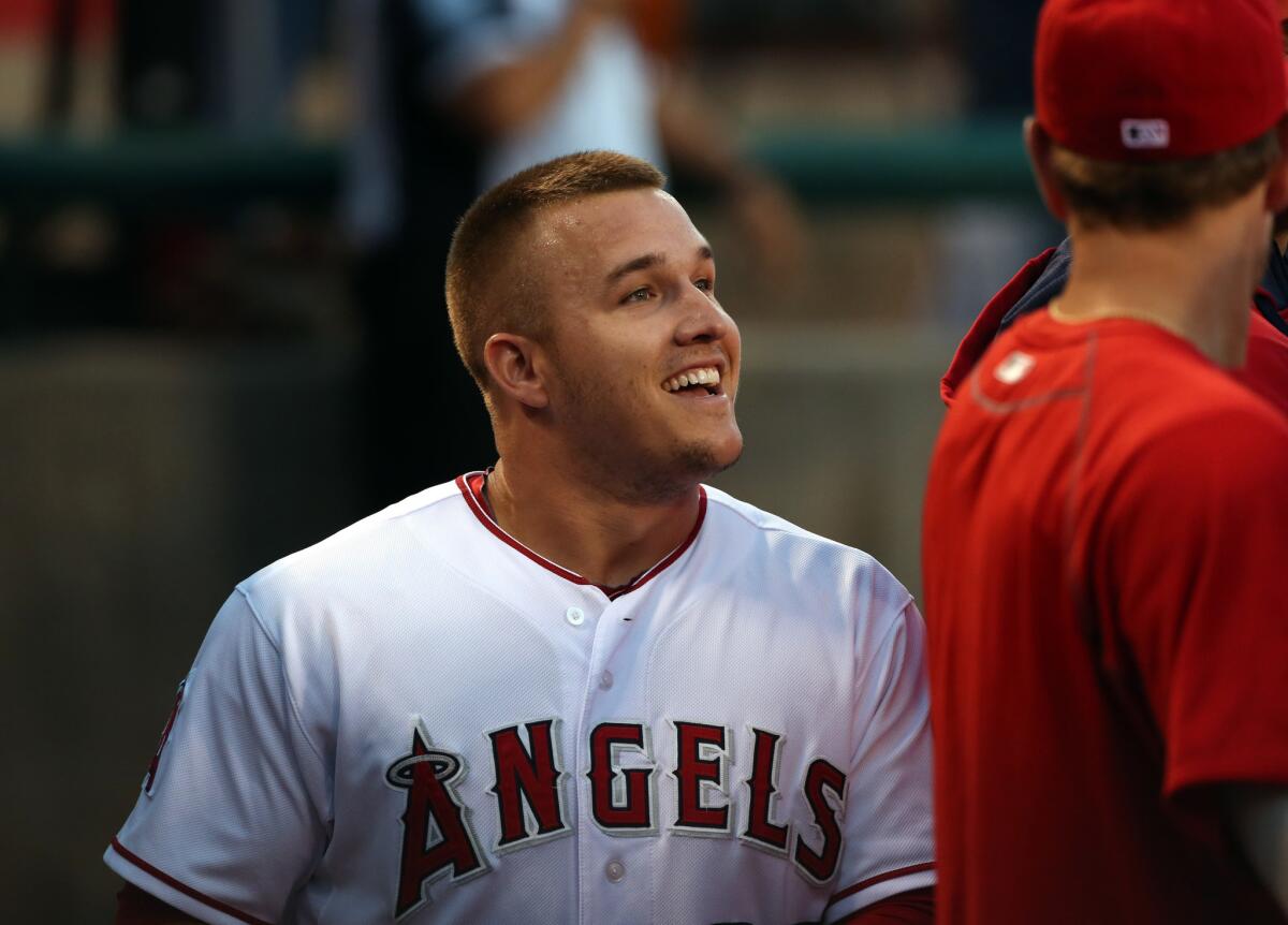 Angels outfielder Mike Trout is all smiles in the dugout after hitting his 33rd home run of the year, on his 24th birthday against the Orioles.