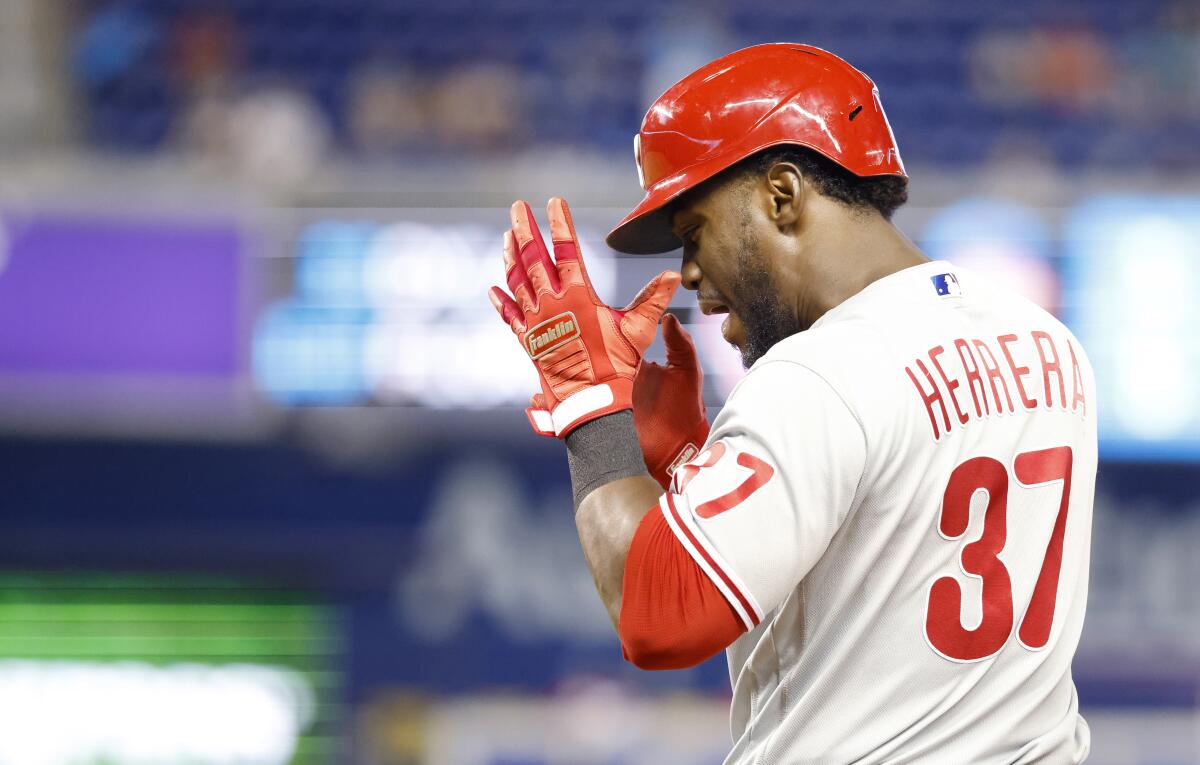 Philadelphia Phillies' Odubel Herrera (37) reacts after singling in a run during the 10th inning of a baseball game against the Miami Marlins, Sunday, Sept. 5, 2021, in Miami. (AP Photo/Rhona Wise)