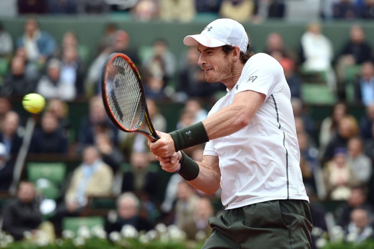 Andy Murray returns the ball to Stan Wawrinka on Friday at the French Open.